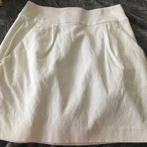 White skirt.